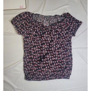 Womens Daisy Fuentes blouse. Black/Pink. Size small. Front string tassels.